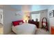 Well-appointed bedroom with a queen bed, dresser, and ample natural light at 5831 Medallion Dr # 103, Las Vegas, NV 89122