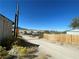 View down a residential street with desert landscape at 12 E Ave, McGill, NV 89318