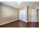 Bright bedroom featuring double door closet and hardwood floors at 1675 Silver Rain Ave, Las Vegas, NV 89123