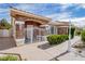 Inviting curb appeal featuring a stone facade, landscaped walkway, and decorative gate at 3980 Equinox Ct, Las Vegas, NV 89147