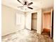 Bright bedroom with ceiling fan, closet, and light gray flooring at 127 Medianoche St, Las Vegas, NV 89138