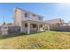 Two-story house with covered patio and grassy backyard at 2751 Desert Stream Ct, Las Vegas, NV 89156