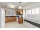 Kitchen with oak cabinets, white appliances, and a breakfast nook at 2751 Desert Stream Ct, Las Vegas, NV 89156