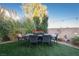 Relaxing backyard patio with seating area and artificial turf at 3368 Epson St, Las Vegas, NV 89129