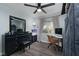 Bedroom with a desk setup, window, and ceiling fan at 3368 Epson St, Las Vegas, NV 89129