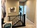 Bright upstairs hallway with modern artwork and neutral tones at 724 Last Dance Pl, Henderson, NV 89011