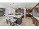 Modern kitchen with dark wood cabinets and a large island with white countertop at , North Las Vegas, NV 89031