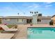 Relaxing pool with steps, surrounded by patio and lawn at 1707 S 8Th St, Las Vegas, NV 89104