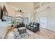 Spacious living room with high ceilings, leather sofas and large TV at 259 Sandrock Pointe Ln, Henderson, NV 89012