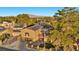 Aerial view of a two-story house with solar panels and a landscaped front yard at 3742 Mcleod Dr, Las Vegas, NV 89121