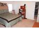 Spacious bedroom with a queen-size bed and built-in shelving at 2231 S Blagg Rd, Pahrump, NV 89048