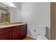 Clean bathroom with dark wood vanity, shower, and toilet at 3356 Racquet St, Las Vegas, NV 89121