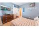 Bright bedroom with a double bed, dresser, and closet at 3718 True Spring Pl, North Las Vegas, NV 89032