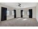 Bright bedroom featuring carpeted floors and ceiling fan at 608 N Racetrack Rd Rd, Henderson, NV 89015