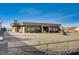 Modern home exterior with desert landscaping and a circular driveway at 608 N Racetrack Rd Rd, Henderson, NV 89015