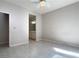 Bedroom with ceiling fan, wood-look floors and en-suite bathroom at 2125 Desert Woods Dr, Henderson, NV 89012