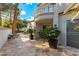 Private patio with flagstone flooring, potted plants, and lounge chair at 8207 Crow Valley Ln, Las Vegas, NV 89113