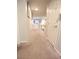 Upstairs hallway with neutral carpet and doors at 5953 Graystone Ridge Ave, Las Vegas, NV 89141