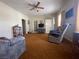 Living room featuring carpet flooring and a ceiling fan at 47 Fourth St, McGill, NV 89318