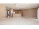 Open living room and kitchen with tile floors at 2516 Cosmic Dust St, Henderson, NV 89044