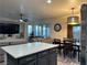 Open concept kitchen with island and dining area view at 2929 Salado Creek Ave, North Las Vegas, NV 89081