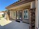 Elegant double door back entrance with stone columns and paver patio at 2900 Foxtail Creek Ave, Henderson, NV 89052