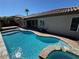 Backyard with a pool, hot tub, and a view of the home's exterior at 2900 Foxtail Creek Ave, Henderson, NV 89052