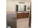 Double vanity bathroom with a tiled shower and flooring at 3968 Steinbeck Dr, Las Vegas, NV 89115