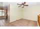 Living area with view into kitchen and ceiling fan at 8423 Elkington Ave, Las Vegas, NV 89128