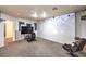 Finished basement game room with projector, gaming chairs, and large screen TV at 1675 English Rose Dr, Las Vegas, NV 89142