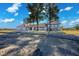 Single-story house with red tile roof and large front yard at 1967 N Moapa Valley Blvd, Logandale, NV 89021