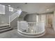 Modern staircase with white railing and grey carpet at 11215 Piazzale St, Las Vegas, NV 89141