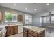 View of kitchen with wood cabinets and island at 11215 Piazzale St, Las Vegas, NV 89141