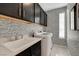 Laundry room with washer, dryer, and stylish backsplash at 7208 Grace Estate Ave, Las Vegas, NV 89113