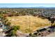 Aerial view of park with field, tennis courts, and surrounding homes at 3040 Lenoir St, Las Vegas, NV 89135