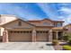 Two-story house with three-car garage and landscaped front yard at 3040 Lenoir St, Las Vegas, NV 89135