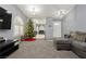 Spacious living room with Christmas tree and view of kitchen at 3576 Judah Way, Las Vegas, NV 89147