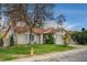 House exterior showcasing a tile roof, mature trees, and a neatly kept lawn at 571 Macbrey Dr, Las Vegas, NV 89123