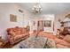 Spacious living room with hardwood floors and a marble-top coffee table at 571 Macbrey Dr, Las Vegas, NV 89123