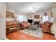 Living room with hardwood floors, fireplace, and elegant, ornate furnishings at 571 Macbrey Dr, Las Vegas, NV 89123