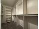 Large walk-in closet with hanging rods and shelving at 6824 Little Brook St, Las Vegas, NV 89131