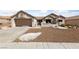 Single-story home with a two-car garage and desert landscaping at 8812 Pennystone Ave, Las Vegas, NV 89134