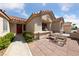 Front patio with seating area and desert landscaping at 8812 Pennystone Ave, Las Vegas, NV 89134