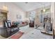 Bright living room with tiled floors and comfy seating at 13 Desert Dawn Ln, Henderson, NV 89074