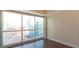 Bright bedroom with hardwood floors and large windows offering city views at 2700 Las Vegas Blvd # 1707, Las Vegas, NV 89109