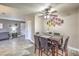 Dining area with dark wood table and chairs and a ceiling fan at 4400 Sandy River Dr # 2, Las Vegas, NV 89103