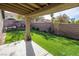 Landscaped backyard with covered patio and water feature at 3701 White Angel Dr, North Las Vegas, NV 89032