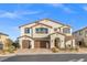 Two-story home with three-car garage and landscaped yard at 4050 Peaceful Dune St, Las Vegas, NV 89129