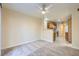 Spacious living room with carpet and open kitchen view at 511 Escoto Pl, Henderson, NV 89052