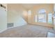 Bright living room featuring high ceilings and a staircase at 511 Escoto Pl, Henderson, NV 89052